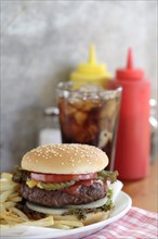 Hamburger and french fries in diner