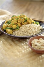 Curry soy tempeh and rice in bowl