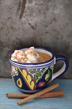 Mexican hot chocolate with cinnamon sticks
