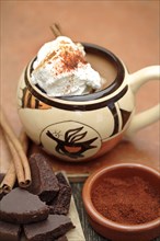 Mexican hot chocolate with cinnamon sticks and chocolate