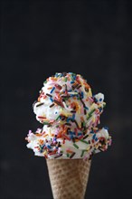Close up of ice cream cone with sprinkles