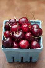 Close up of bing cherries in carton