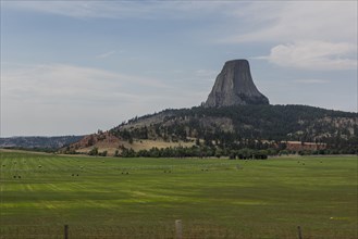 Devils Tower rock and farm fields in remote landscape