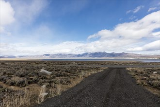 Gravel road and distant mountain range