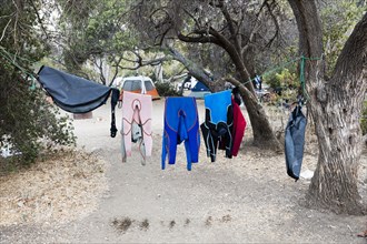 Wet clothing hanging on clothesline near camping tent