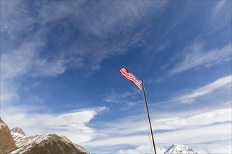 American flag near mountains