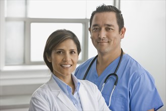 Smiling doctors standing together