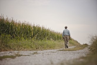 African American man walking on remote path