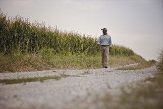 African American man walking on remote path