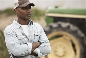 African American farmer with arms crossed