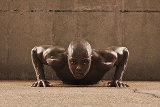 African American man doing push-ups