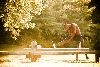 African American man stretching before exercise