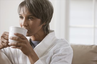 Native American woman drinking coffee