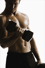 Caucasian man lifting weights