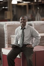 Black businessman working in warehouse