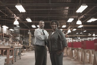 Black business people standing in warehouse