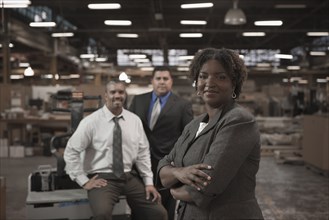 Business people standing in warehouse