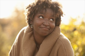 Smiling Black woman outdoors