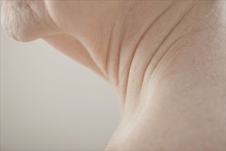 Close up of Caucasian woman's aging neck