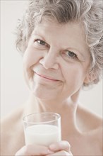 Caucasian woman drinking milk