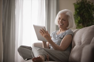 Caucasian woman using digital tablet
