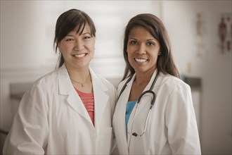 Smiling doctor standing together
