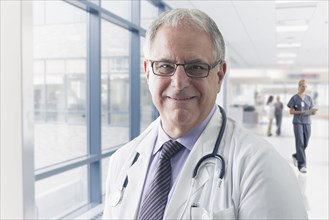 Caucasian doctor smiling in hospital