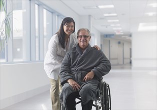 Doctor smiling with patient in hospital