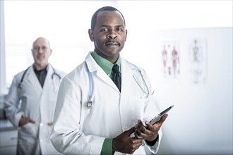 African American doctor standing in office