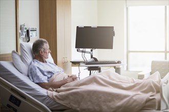 Caucasian patient sitting in hospital bed