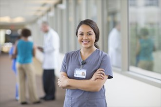 Nurse smiling in hallway