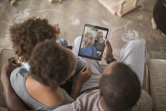 Family video chatting with digital tablet