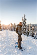 Caucasian woman snowshoeing in remote area
