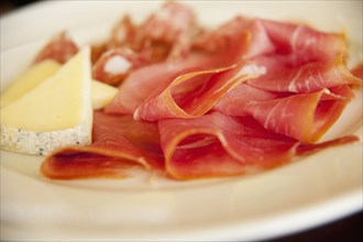 Close up of cheese and  prosciutto