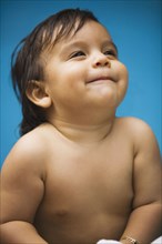 Close up of smiling Hispanic baby boy