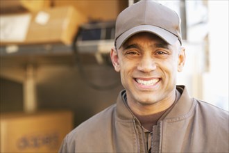 Smiling Hispanic delivery man