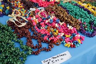 Corn necklaces for sale on table