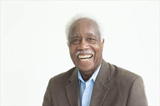 Portrait of laughing older Black man