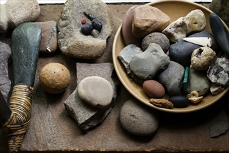 Stones in bowl and traditional tools