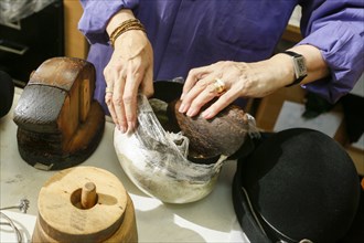 Hands of woman creating hat