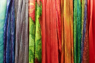 Row of multicolor scarves