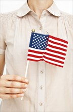 Woman holding repaired American flag