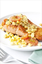 Salmon and corn on plate