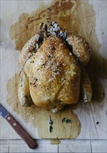 Roast chicken on cutting board