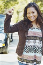 Young woman holding car keys