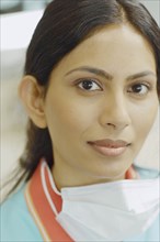Close up of Indian female dental assistant