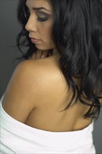 Hispanic woman with bare shoulders