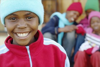 African boy with friends in background