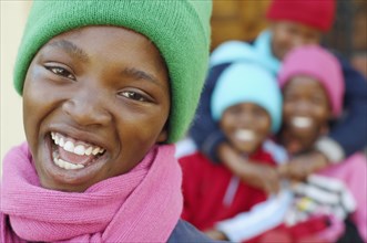 African girl with friends in background