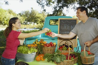 Hispanic couple at organic farm stand